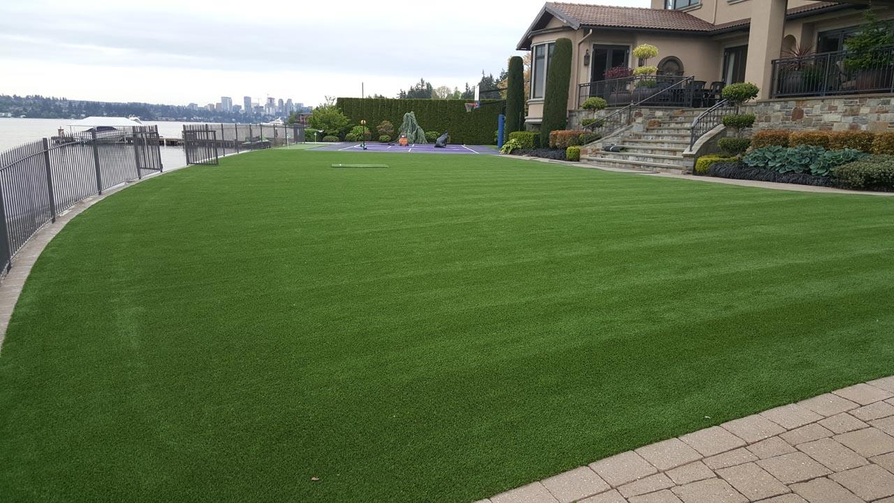 زرع العشب الصناعي Laying Synthetic Turf